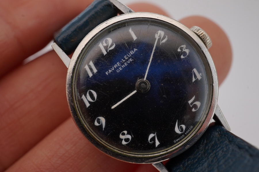 A lady's stainless steel Favre Leuba manual wind wrist watch, with lapis lazuli Arabic dial, case diameter 23mm, on an associated leather strap. Condition - fair